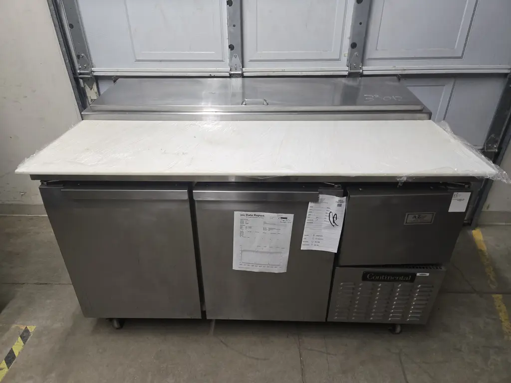 CONTINENTAL 2 DOOR 1 DRAWER PREP TABLE ON CASTERS NSF